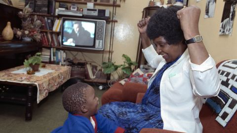 Madikizela-Mandela is pictured with her grandson in 1986.
