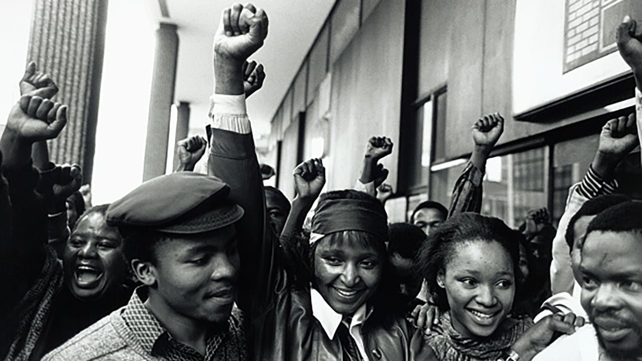 Madikizela-Mandela, center, celebrates alongside her daughter Zindzi and other supporters following her release from Johannesburg Magistrates Court. She had been arrested for defying a court order that banned her from entering Soweto, an area at the center of the anti-apartheid movement in Johannesburg.