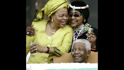 Madikizela-Mandela, right, joins her ex-husband and his third wife, Graca Machel, during his 90th birthday celebrations in Tshwane, South Africa, in 2008.