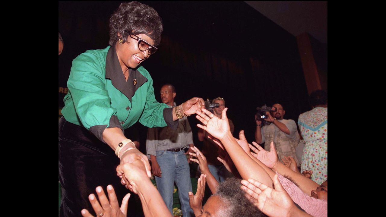 Madikizela-Mandela shakes hands with supporters in Rustenburg, South Africa, in 1997. She had just been elected president of the African National Congress Women's League.
