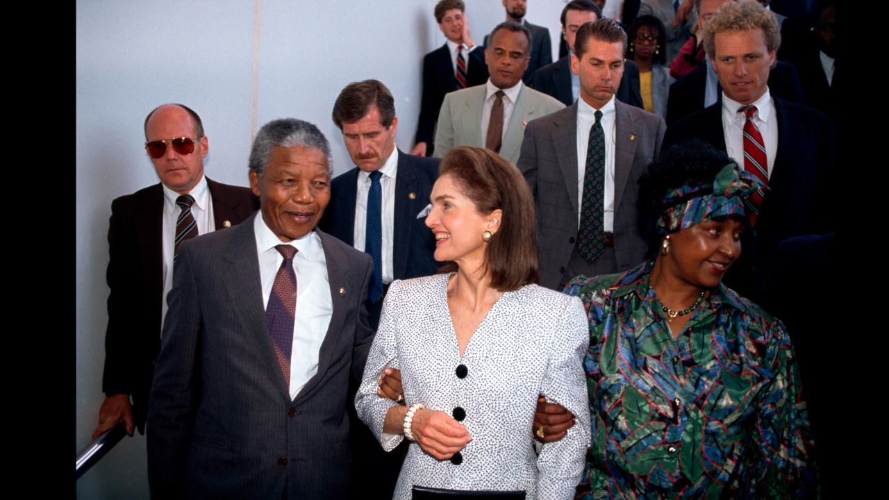 The Mandelas are welcomed by former first lady Jackie Kennedy during a visit to Boston in 1990.