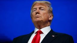 President Donald Trump listens as he is introduced to deliver a speech to the World Economic Forum, Friday, Jan. 26, 2018, in Davos. (AP Photo/Evan Vucci)