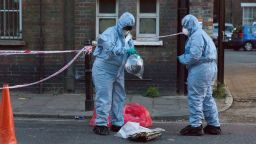 Police forensic officers at the crime scene cordon on Burnham Street just off Roman Road this evening near Singh supermarket. Two males in their late teens have been taken to hospital for treatment after an unknown liquid was thrown at them. Bethnal Green acid attack, London, UK - 25 Jul 2017 (Rex Features via AP Images)
