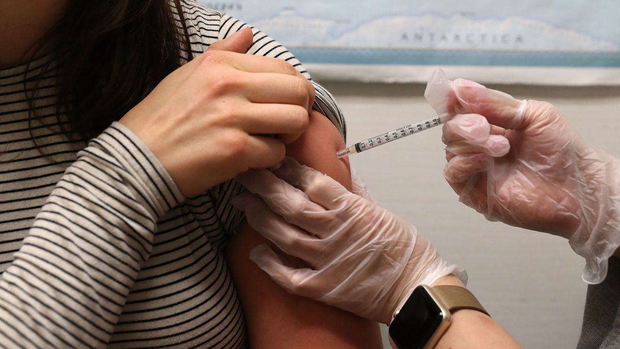 SAN FRANCISCO, CA - JANUARY 22: Simone Groper receives a flu shot at a Walgreens phramacy on January 22, 2018 in San Francisco, California. A strong strain of H3N2 influenza has claimed the lives of 74 Californians under the age of 65 since the flu season began in October of last year. People are being encouraged to get flu shots even through the vaccine has been only 30% effective in combating the influenza. (Photo by Justin Sullivan/Getty Images)