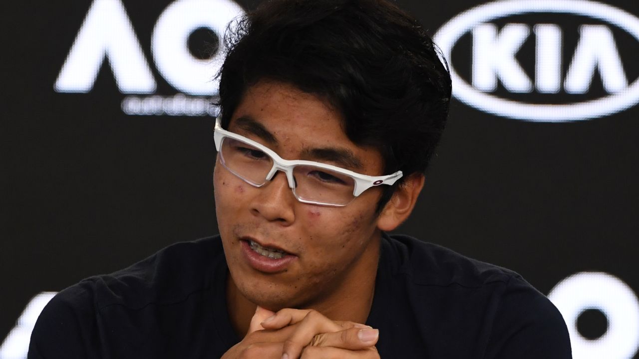 Hyeon Chung speaks to reporters.