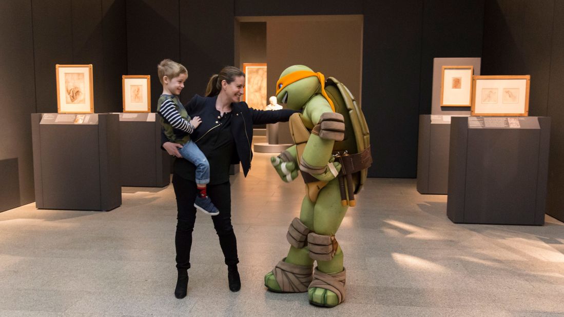 The fictional turtle, who met some fans inside the museum, was named after Renaissance artist Michelangelo Buonarroti.