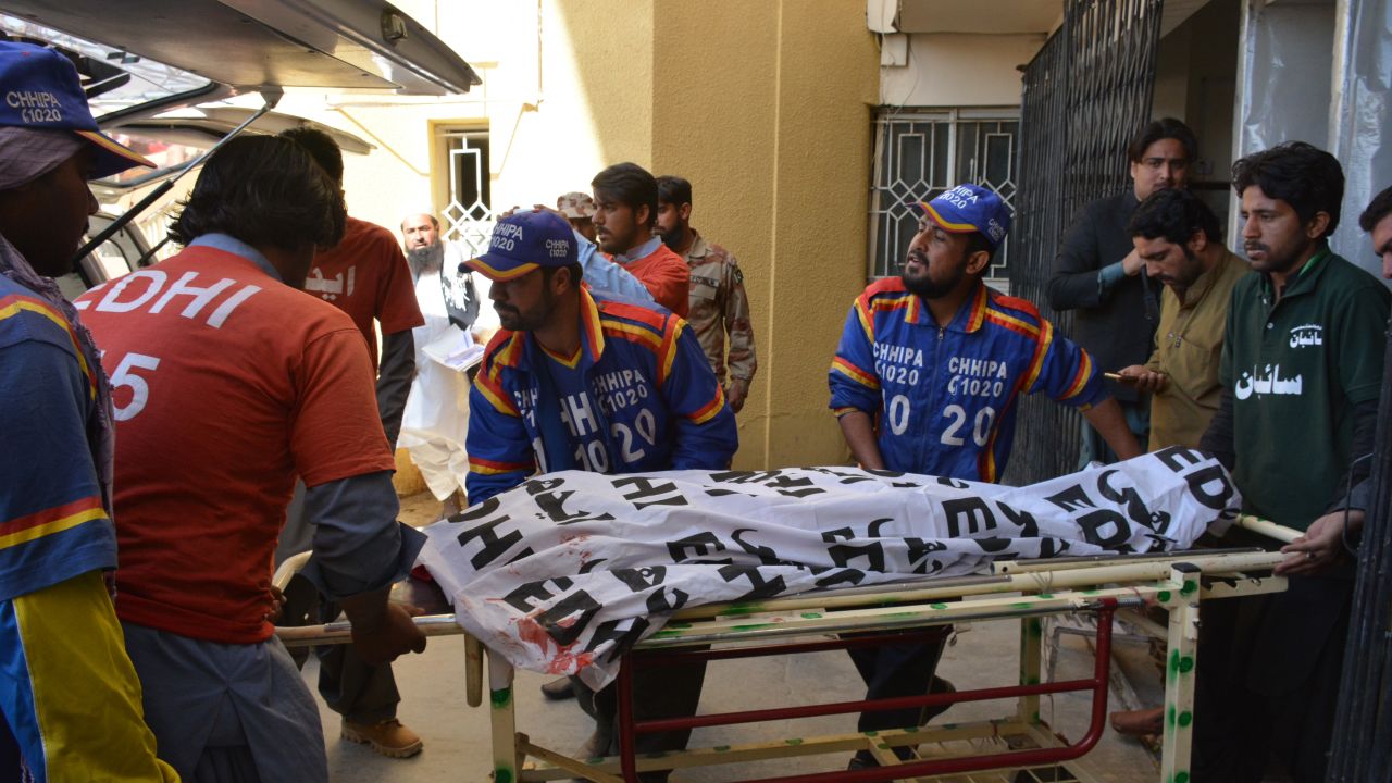 Pakistani volunteers transport the body of a polio worker from a hospital following an attack by gunmen in Quetta on January 18, 2018.