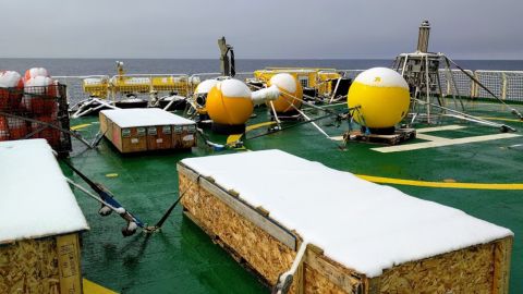 Boxes with underwater robots sit on the deck of an icebreaker on its way to Antarctica for research.