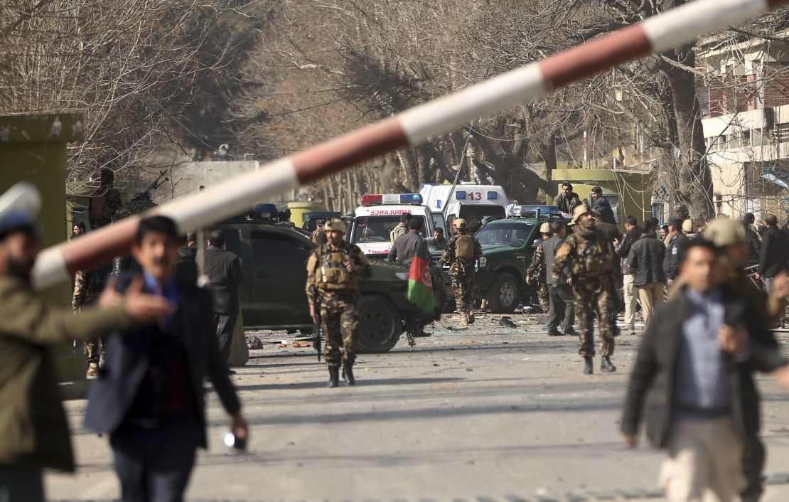 Security forces inspect the site of Saturday's attack in the center of the Afghan capital.