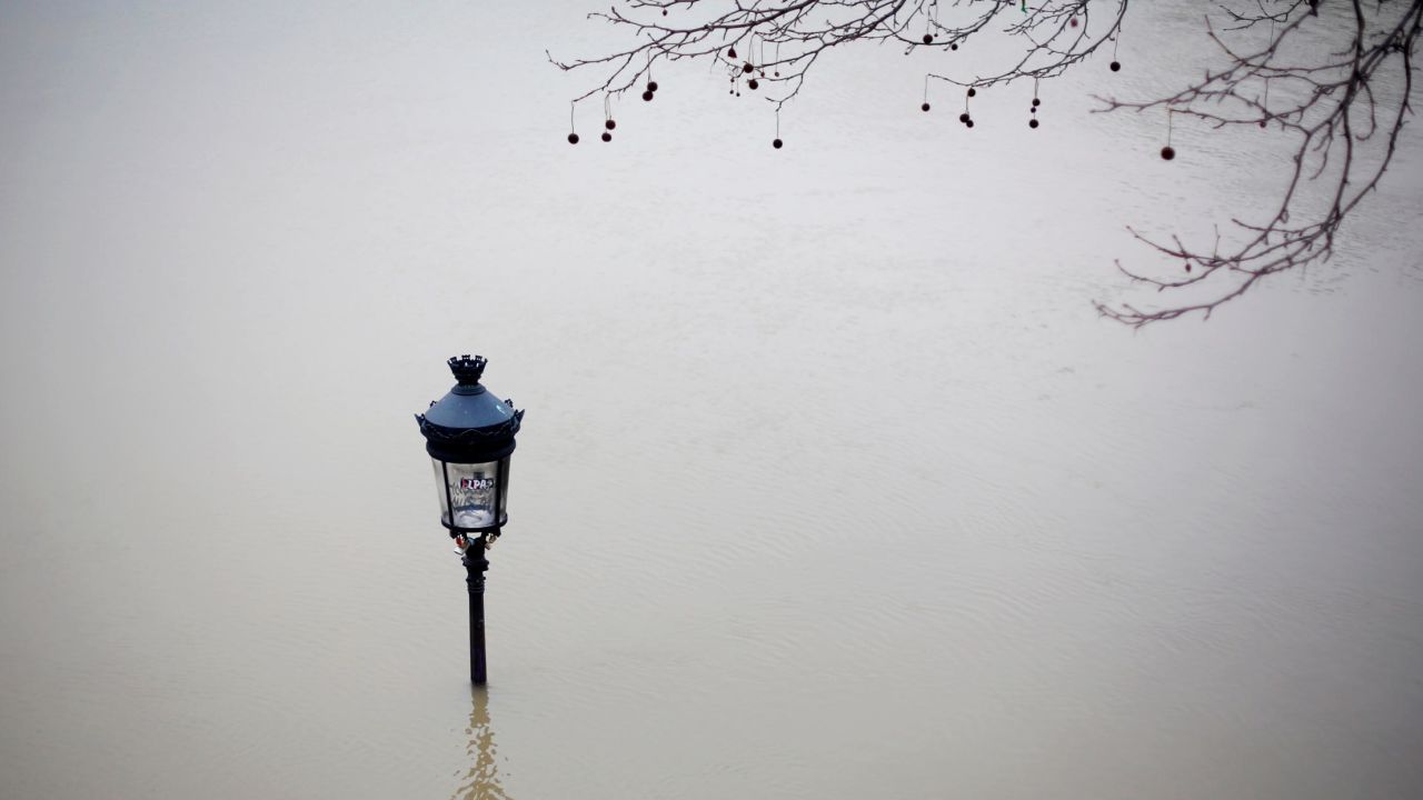 A street lamp is visible in floodwaters Saturday next to the Seine in Paris.