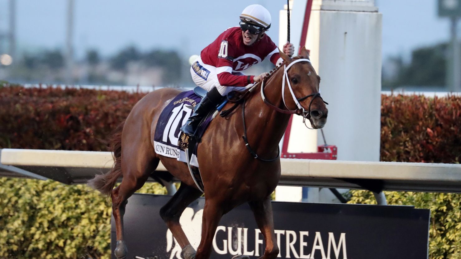 Jockey Florent Geroux celebrates as Gun Runner crosses the finish line to win the Pegasus World Cup.