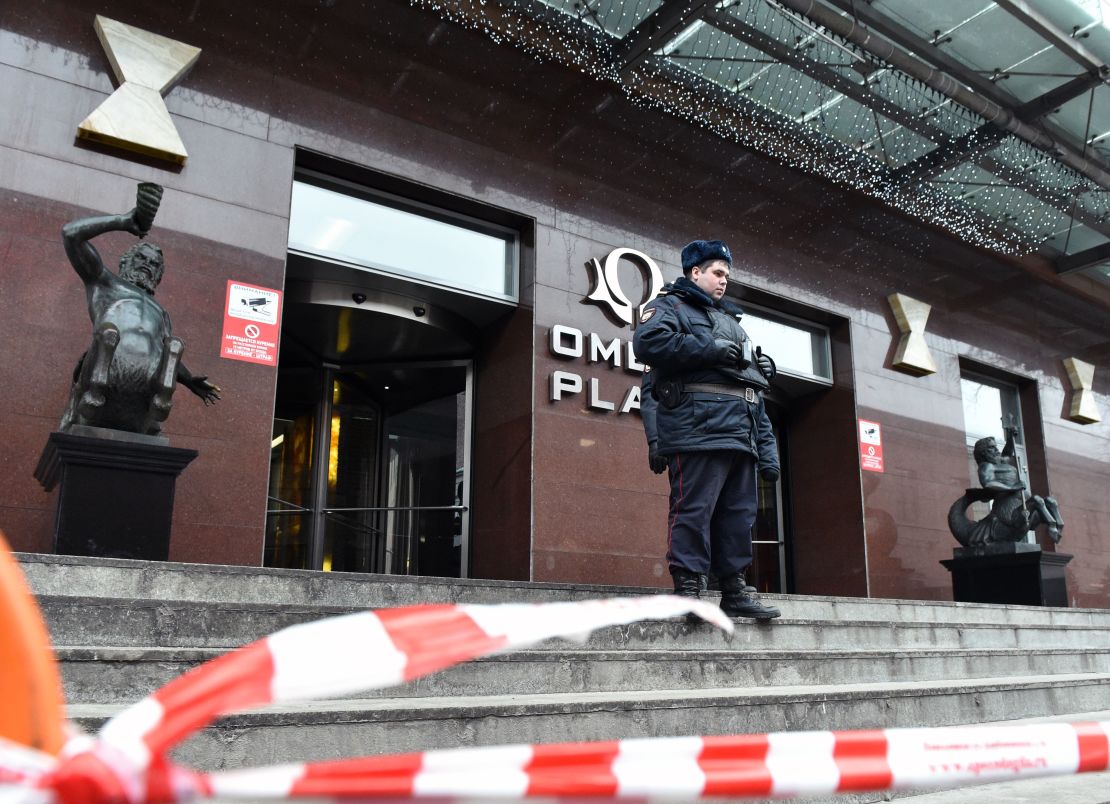 A Russian police officer stands outside Alexei Navalny's Moscow office on Sunday.