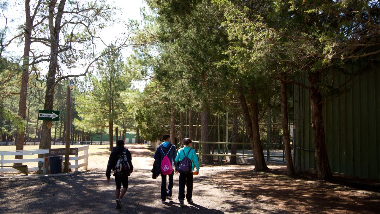 Athletes walk across Karolyi Ranch in 2011. Elite gymnasts from across the country came to train at the ranch.