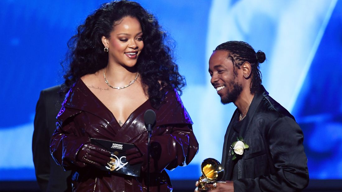 Kendrick Lamar is joined by Rihanna as he accepts the first Grammy of the television broadcast. The two teamed up for "Loyalty," which won the award for best rap/sung performance.