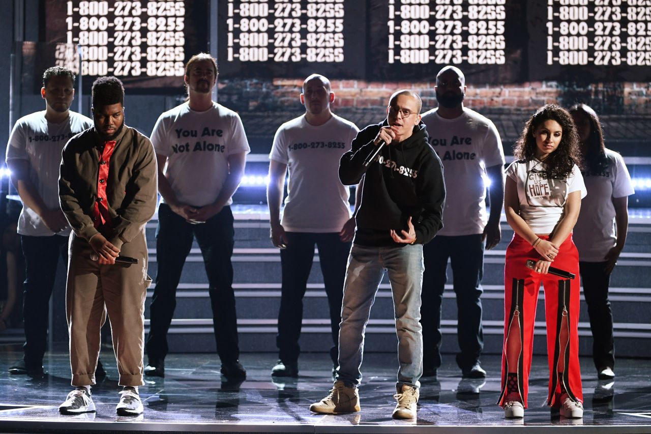 From left, Khalid, Logic and Alessia Cara perform "1-800-273-8255." The song title is the phone number of the National Suicide Prevention Lifeline. 