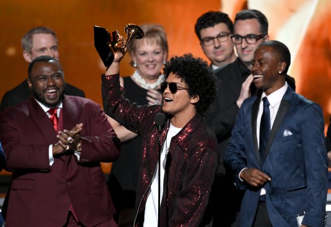 Bruno Mars accepts the Grammy Award for album of the year, which he won for "24K Magic" on Sunday, January 28. Mars also won the Grammys for song of the year ("That's What I Like") and record of the year ("24K Magic").