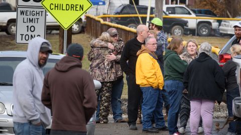 Family members,  friends console each other after four people are killed at a Pennsylvania car wash. 