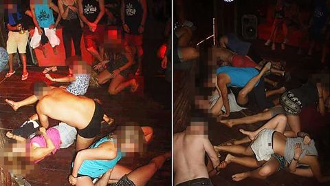 A group of unidentified foreigners, who are accused of "dancing pornographically" at a party in Siem Reap town, in a photo issued by Cambodian police from January 25. CNN has blurred the faces of the people in this photograph for their privacy.