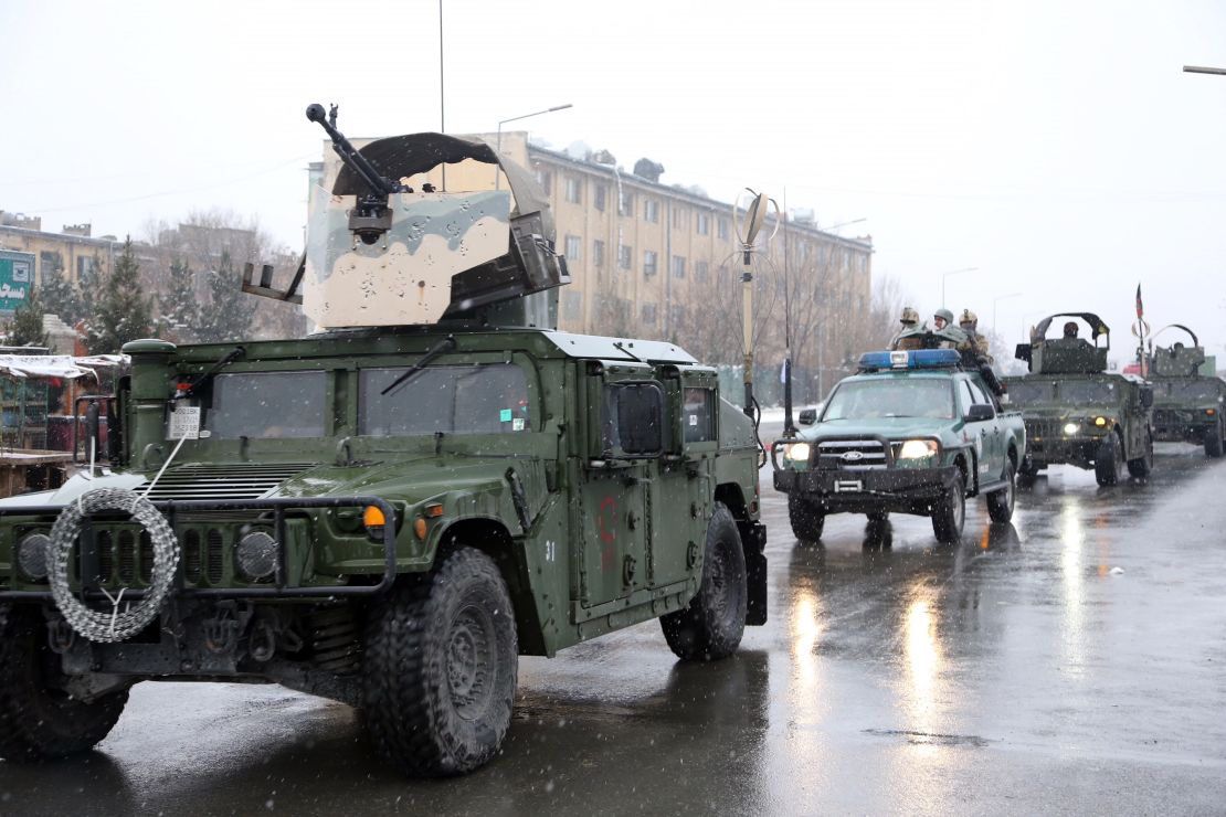 Afghan security personnel arrive at the site of an attack at the Marshal Fahim academy.