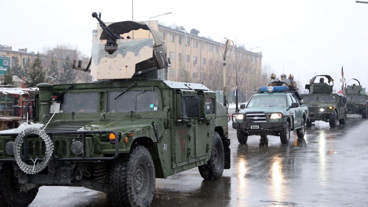 Afghan security personnel arrive at the site of an attack at the Marshal Fahim academy in Kabul, Afghanistan Monday, Jan. 29, 2018. An Afghan official and an eyewitness say blasts have been heard and a gunbattle is occurring near the military academy in the capital Kabul.  (AP Photo/ Rahmat Gul)