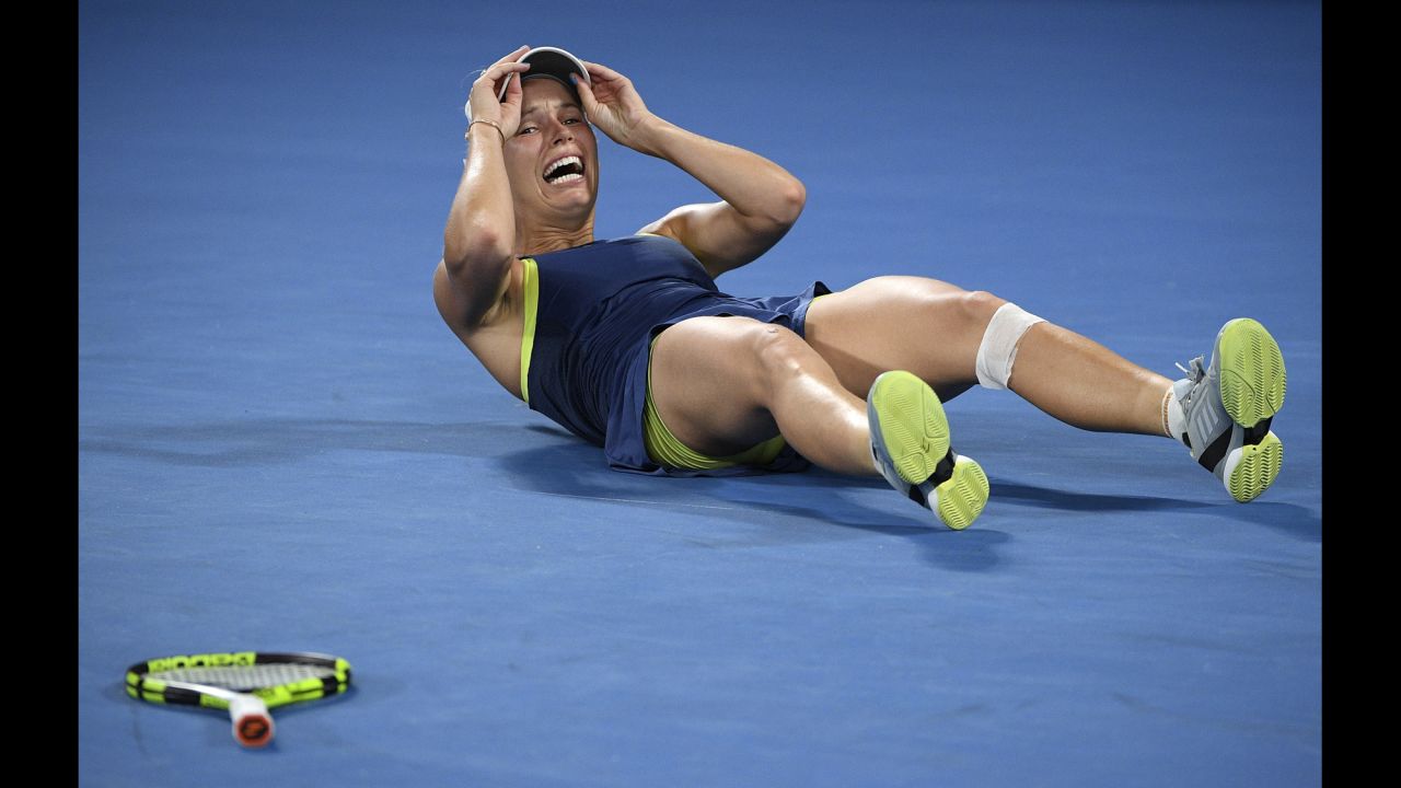 Caroline Wozniacki falls to the ground after winning the Australian Open title on Saturday, January 27. It is the first major title for Wozniacki, <a href="https://www.cnn.com/2018/01/27/sport/australian-open-halep-wozniacki-tennis/index.html" target="_blank">who defeated Simona Halep in a three-set final</a> that lasted nearly three hours.