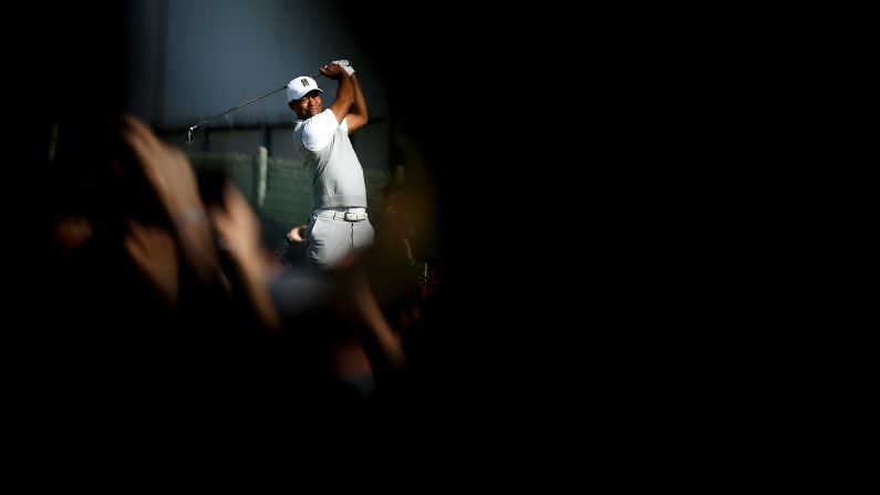 Tiger Woods plays a shot during the third round of the Farmers Insurance Open on Saturday, January 27. Woods finished tied for 23rd in the tournament, which was his first PGA Tour event in a year.