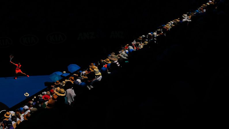 Fans watch Grigor Dimitrov play a backhand during an Australian Open quarterfinal match on Tuesday, January 23.