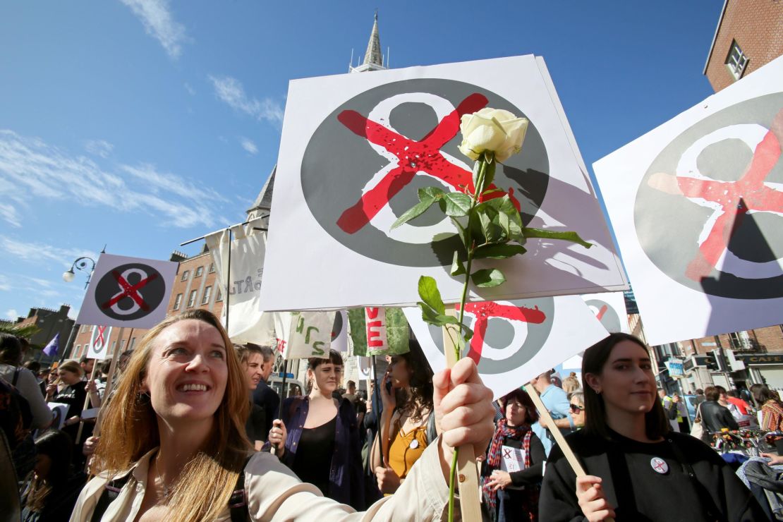 Protesters hold up placards against the Eighth Amendment in on September.