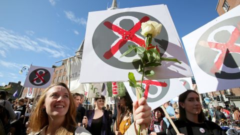 Protesters hold up placards against the Eighth Amendment in on September.