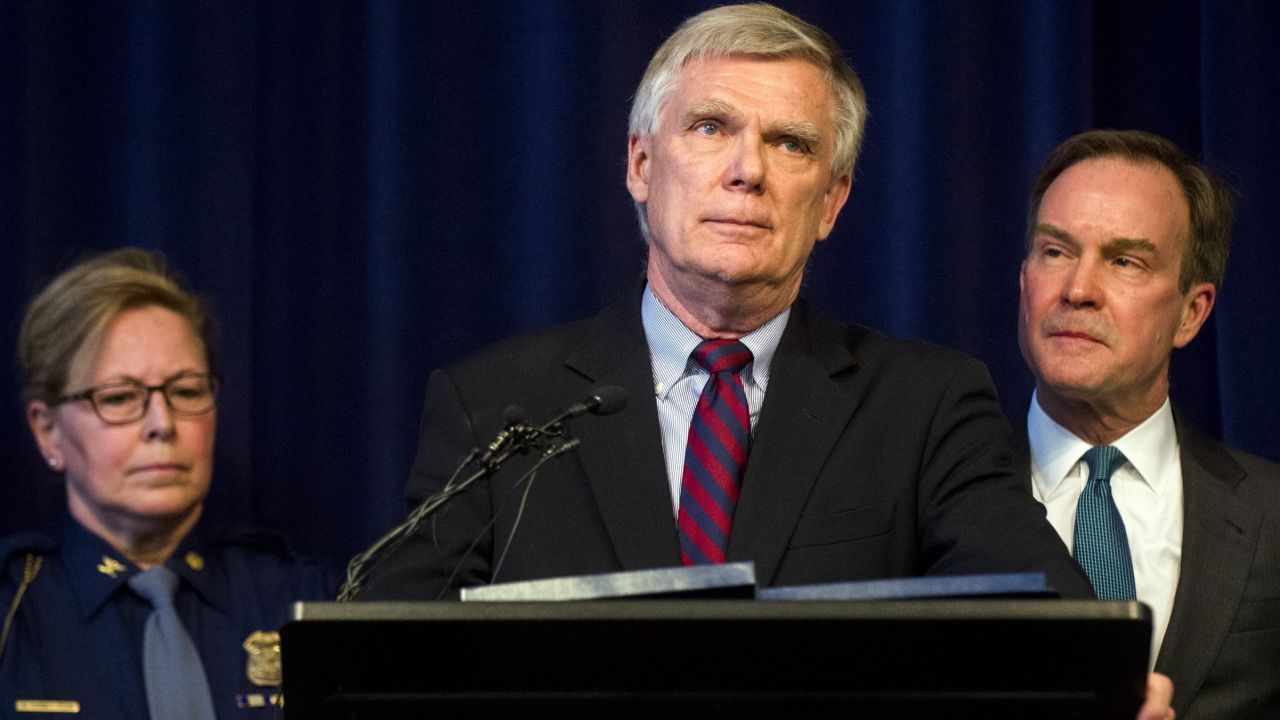 William Forsyth, a former Kent County prosecutor, speaks after Attorney General Bill Schuette, right, announced an open and ongoing investigation into the systemic issues with sexual misconduct at Michigan State University that began in 2017 on Saturday, Jan. 27, 2018 at the G. Mennen Williams Building in Lansing, Mich.  Schuette said  that the independent probe will shine a bright light on every corner of the university.    (Jake May/The Flint Journal-MLive.com via AP)