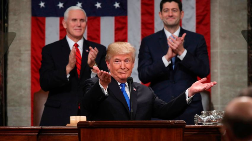 President Donald Trump gestures as delivers his first State of the Union address in the House chamber of the U.S. Capitol to a joint session of Congress Tuesday, Jan. 30, 2018 in Washington, as Vice President Mike Pence and House Speaker Paul Ryan applaud. (Win McNamee/Pool via AP)