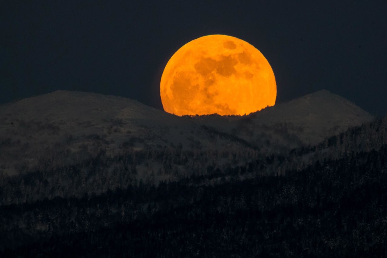 The moon rises over hills near the city of Yuzhno-Sakhalinsk on Sakhalin Island in Russia's Far East.