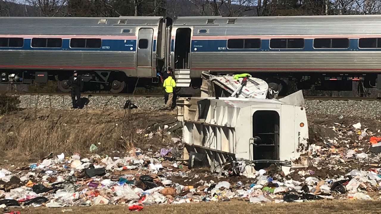 Emergency personnel work at the scene of a train crash involving a garbage truck in Crozet, Va., on Wednesday, Jan. 31, 2018. An Amtrak passenger train carrying dozens of GOP lawmakers to a Republican retreat in West Virginia struck a garbage truck south of Charlottesville, Va. No lawmakers were believed injured. (Zack Wajsgrasu/The Daily Progress via AP)