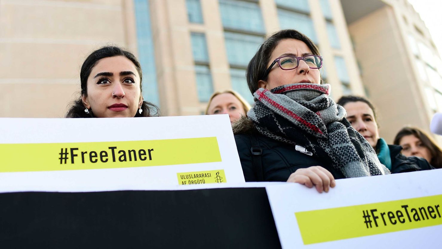 A group of human rights activists gather outside an Istanbul courthouse on Wednesday.
