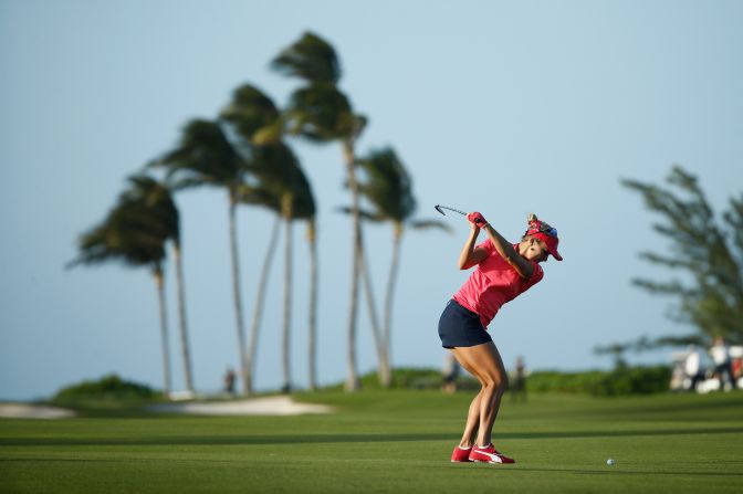 <strong>In paradise:</strong> Lexi Thompson plays in strong winds at the Pure Silk Bahamas LPGA Classic at the Ocean Club Golf Course on Paradise Island.