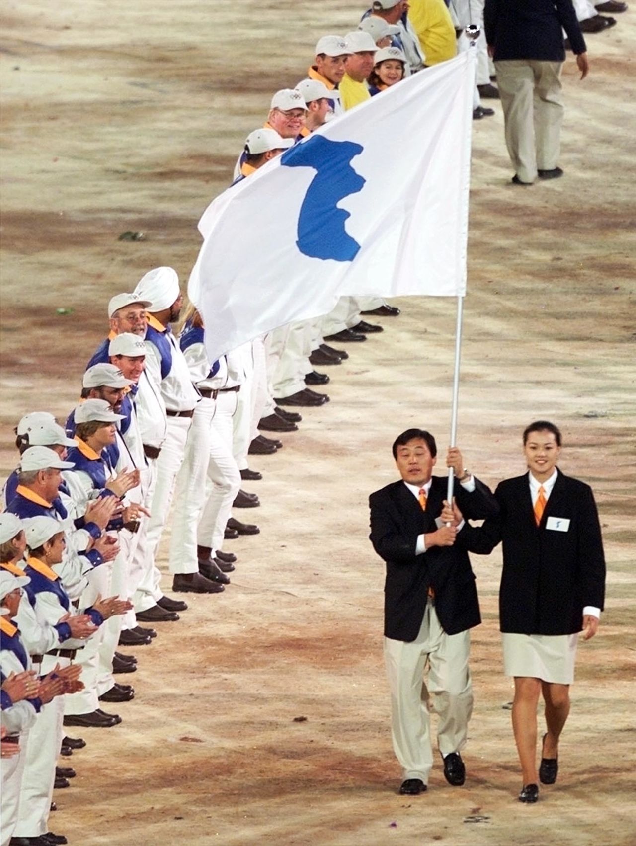 Flag bearers Jang Choo Pak (left) of North Korea and Eun-Soon Chung of South Korea carry a special flag with the image of the Korean peninsula, at the head of their joint delegation during the opening ceremony of the 2000 Summer Olympics in Sydney 15 September 2000.