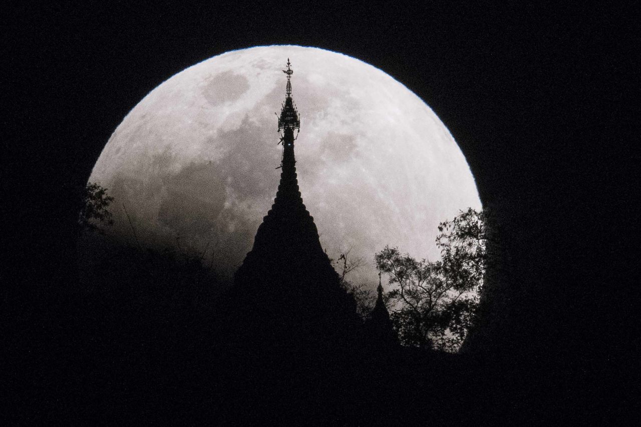 The moon rises over a pagoda in Kumal, Myanmar.