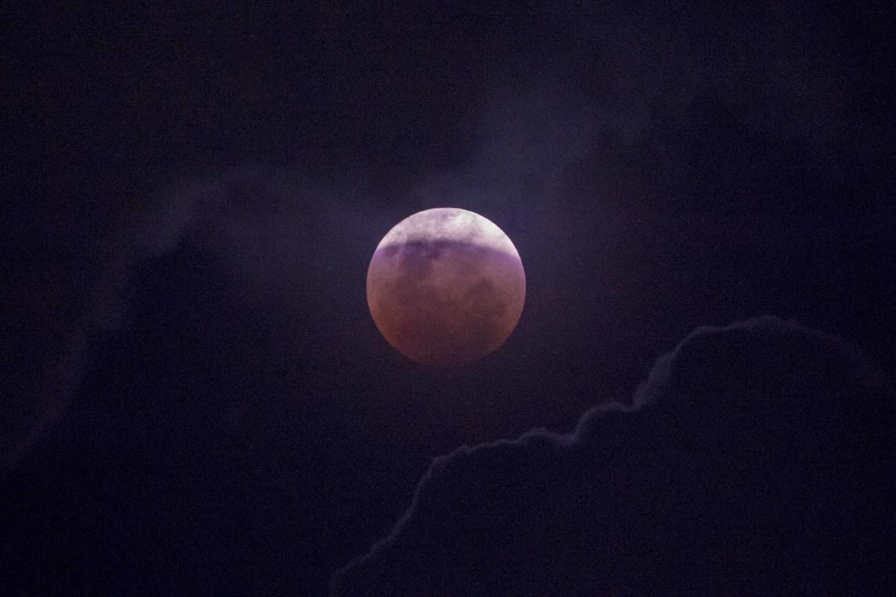 The moon is seen during a lunar eclipse in Jakarta, Indonesia.
