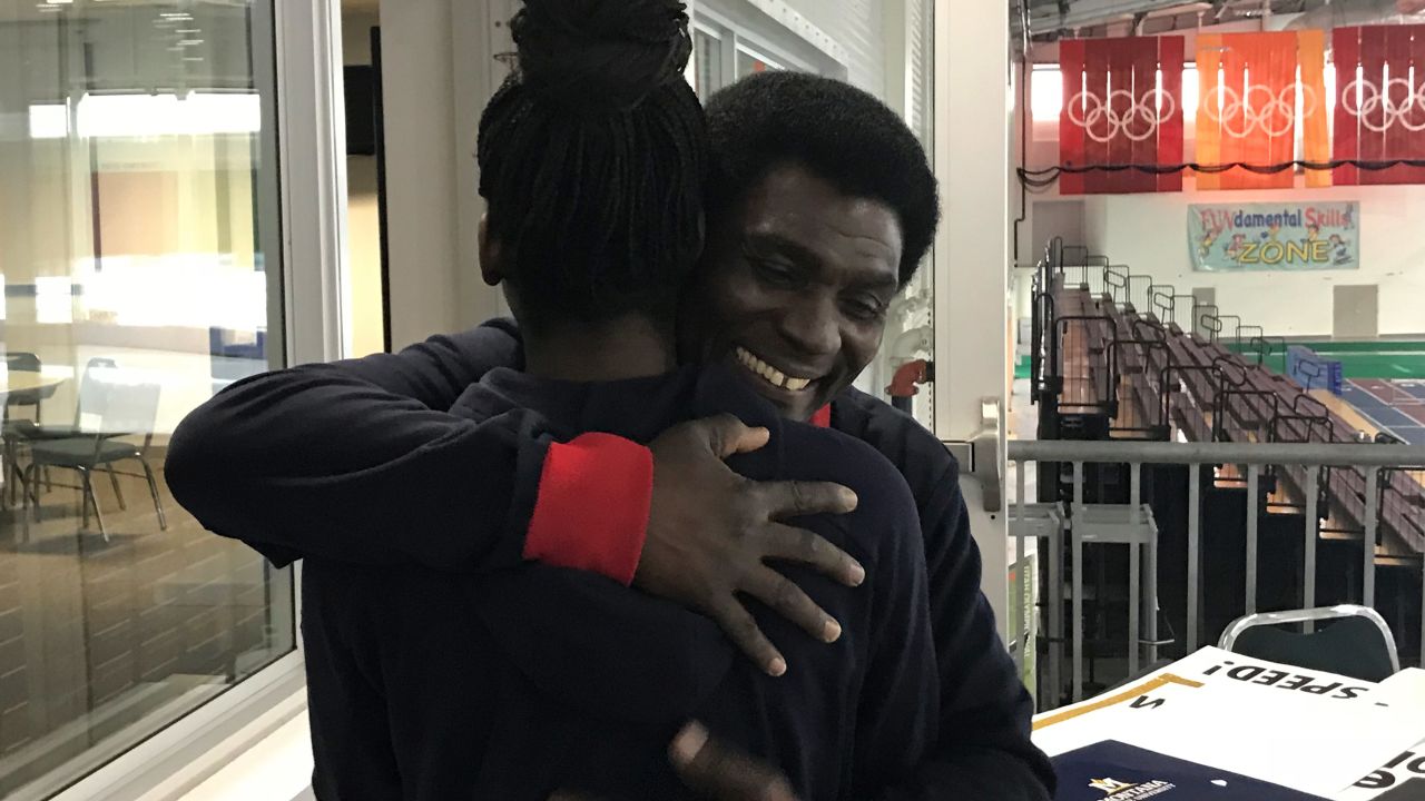 Kweku Biney embraces his daughter at the Utah Olympic Oval last month. 