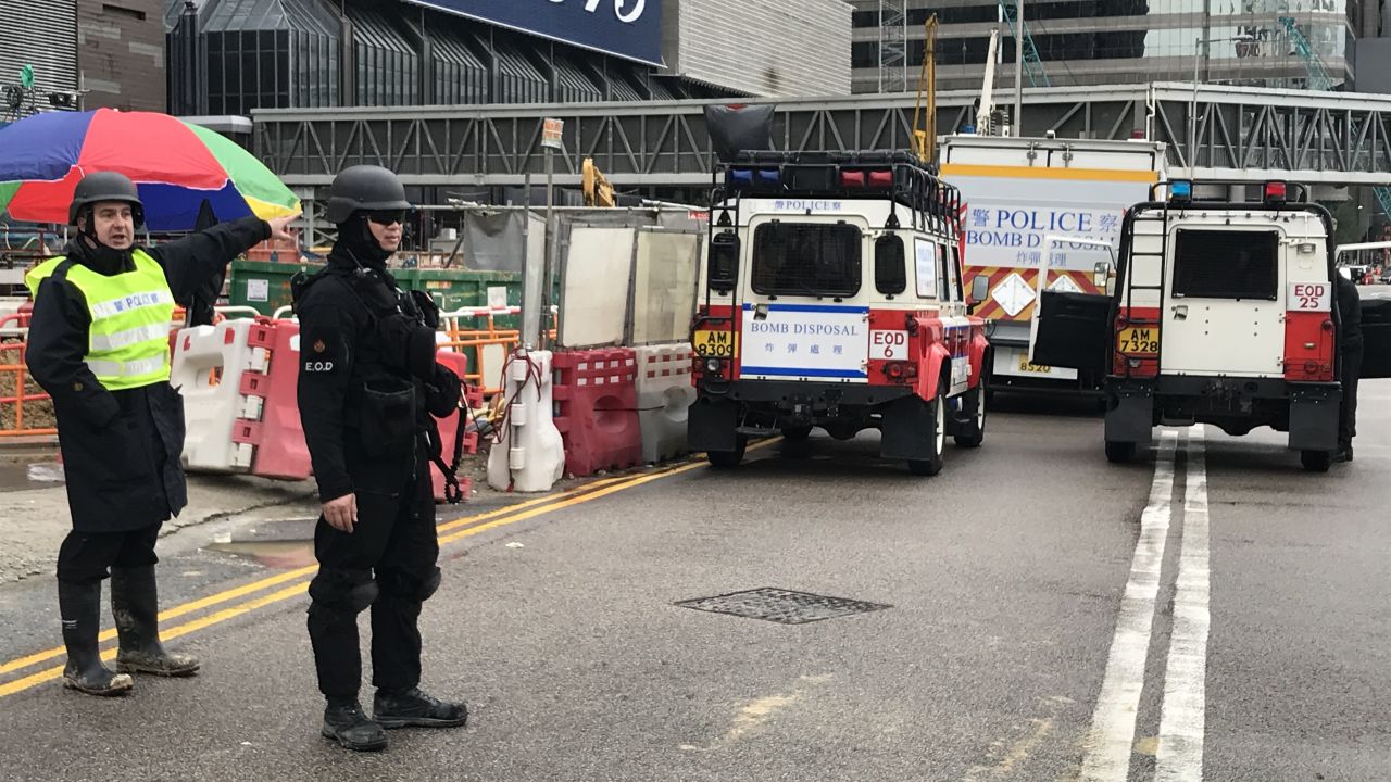 Police are present Wednesday outside the Hong Kong construction site where the explosive was found.