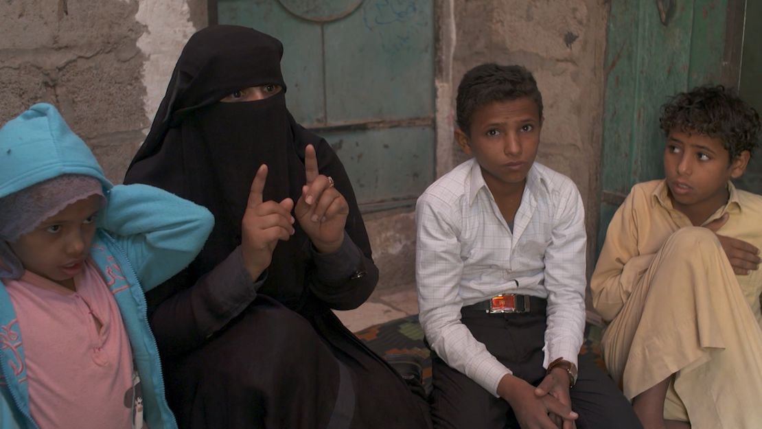 Ex-child soldier Younis, 13 (second from right), and his mother Samira speak about the boy's enduring nightmares from his time in battle.