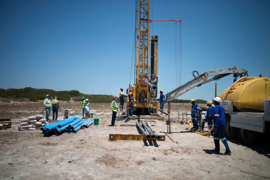 A team prepares a site where the Cape Town city council has ordered drilling into the aquifer to tap water, in Mitchells Plains, Cape Town.
