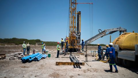A team prepares a site where the Cape Town city council has ordered drilling into the aquifer to tap water, in Mitchells Plains, Cape Town. 