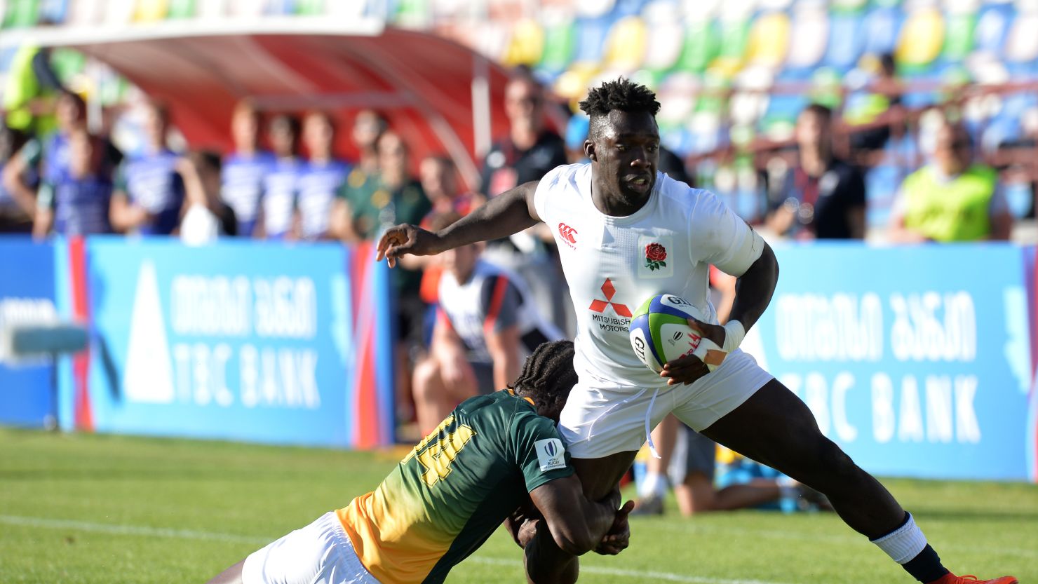 Gabriel Ibitoye of England is tackled by Yaw Penxe of South Africa during the World Rugby U20 Championship Semi Final match between England and South Africa at Mikheil Meskhi Stadium on June 13, 2017 in Tbilisi, Georgia. (Photo by Mark Runnacles/Getty Images)