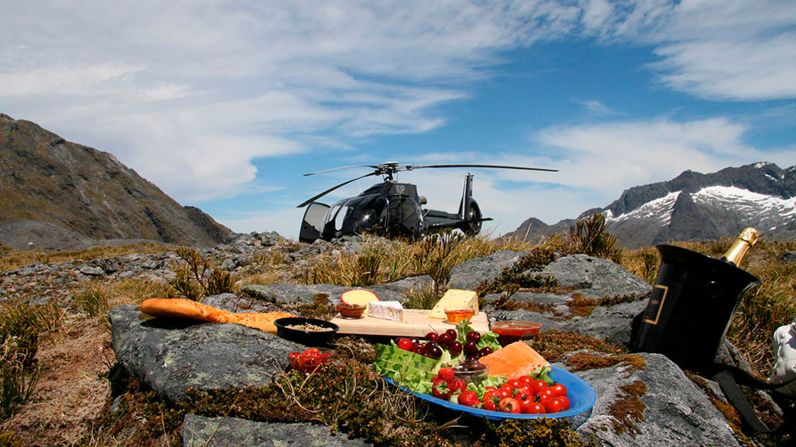 <strong>Heli-picnic in New Zealand: </strong>Could there be a better way of taking in the incredible views of Lake Wakatipu and the Southern Alps of New Zealand than enjoying a champagne picnic on a majestic peak?