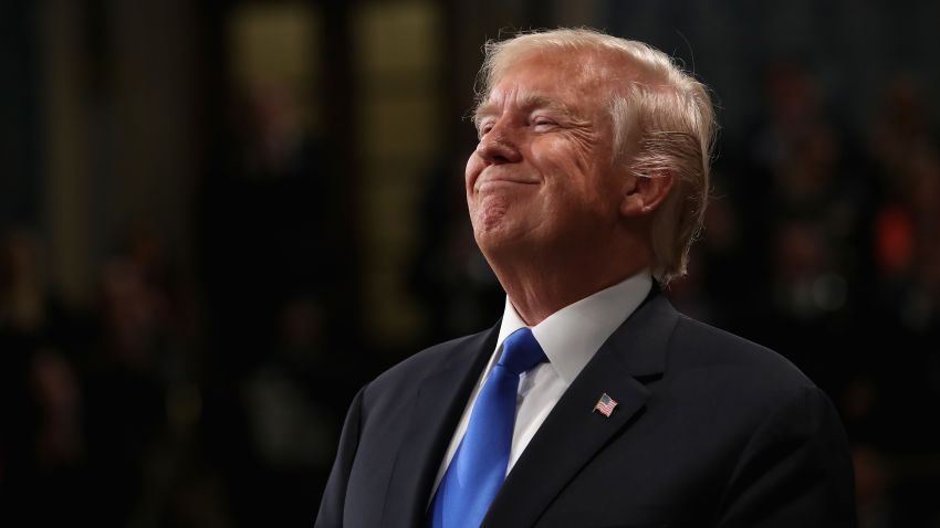 TOPSHOT - US President Donald Trump smiles during the State of the Union address in the chamber of the US House of Representatives on January 30, 2018 in Washington, DC. / AFP PHOTO / POOL / Win McNamee (Photo credit should read WIN MCNAMEE/AFP/Getty Images)