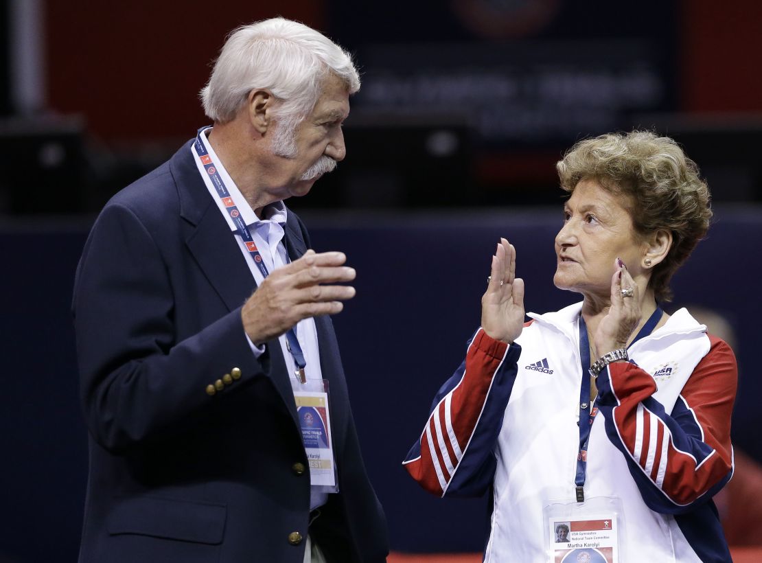 Husband and wife Bela and Martha Karolyi talk before the US women's Olympic gymnastics trials in 2012.