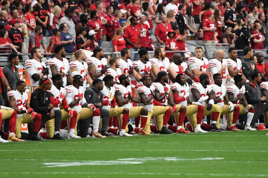 Members of the San Francisco 49ers kneel during the National Anthem ahead of their game against the Arizona Cardinals at the University of Phoenix Stadium in Glendale, Arizona. Former 49ers quarterback Colin Kaepernick sparked the anthem protest when he took a knee in September 2016 to call attention to racism and police brutality.