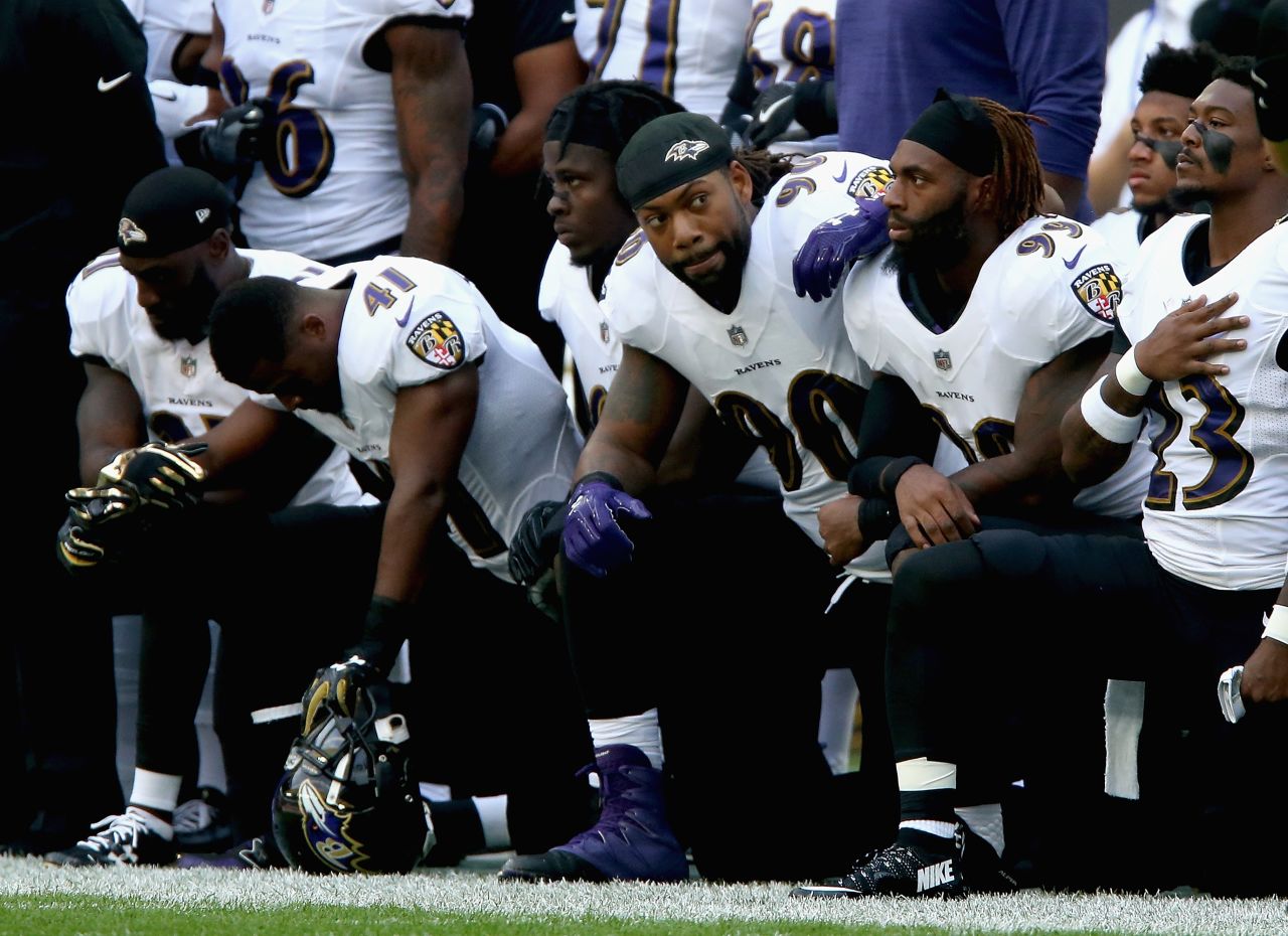 Baltimore Ravens players kneel during the National Anthem during the NFL International Series match against the Jacksonville Jaguars at Wembley Stadium in London.