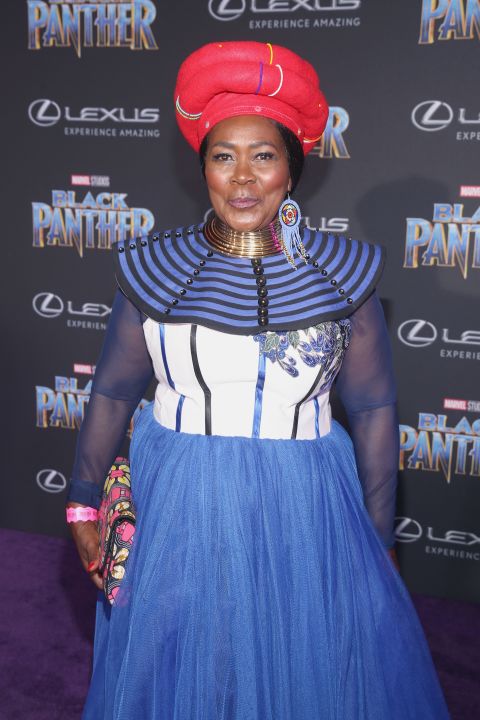 South African actor Connie Chiume, who plays the mining tribe elder in Wakanda, stuns in her native South African attire.<br /><br /><em>Black Panther opens in theaters on February 16, 2018.</em>